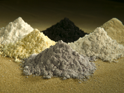 small piles of different colored rare-earth elements