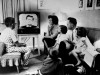 family around TV set in 1960