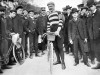 pro cyclist with bike and crowd, 1905