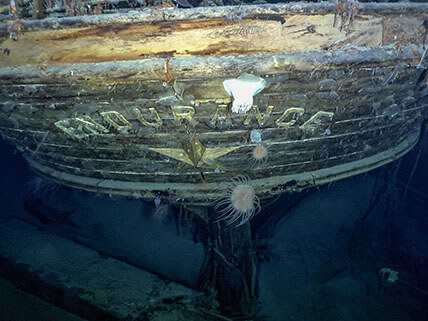 Image of a ship underwater with the name "Endurance" on it.